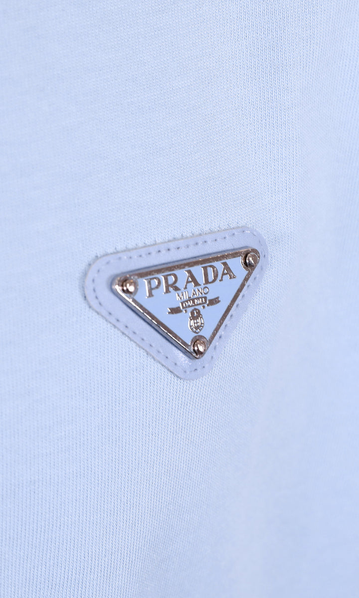 PRADA METAL LOGO PATCH LIGHT BLUE T-SHIRT